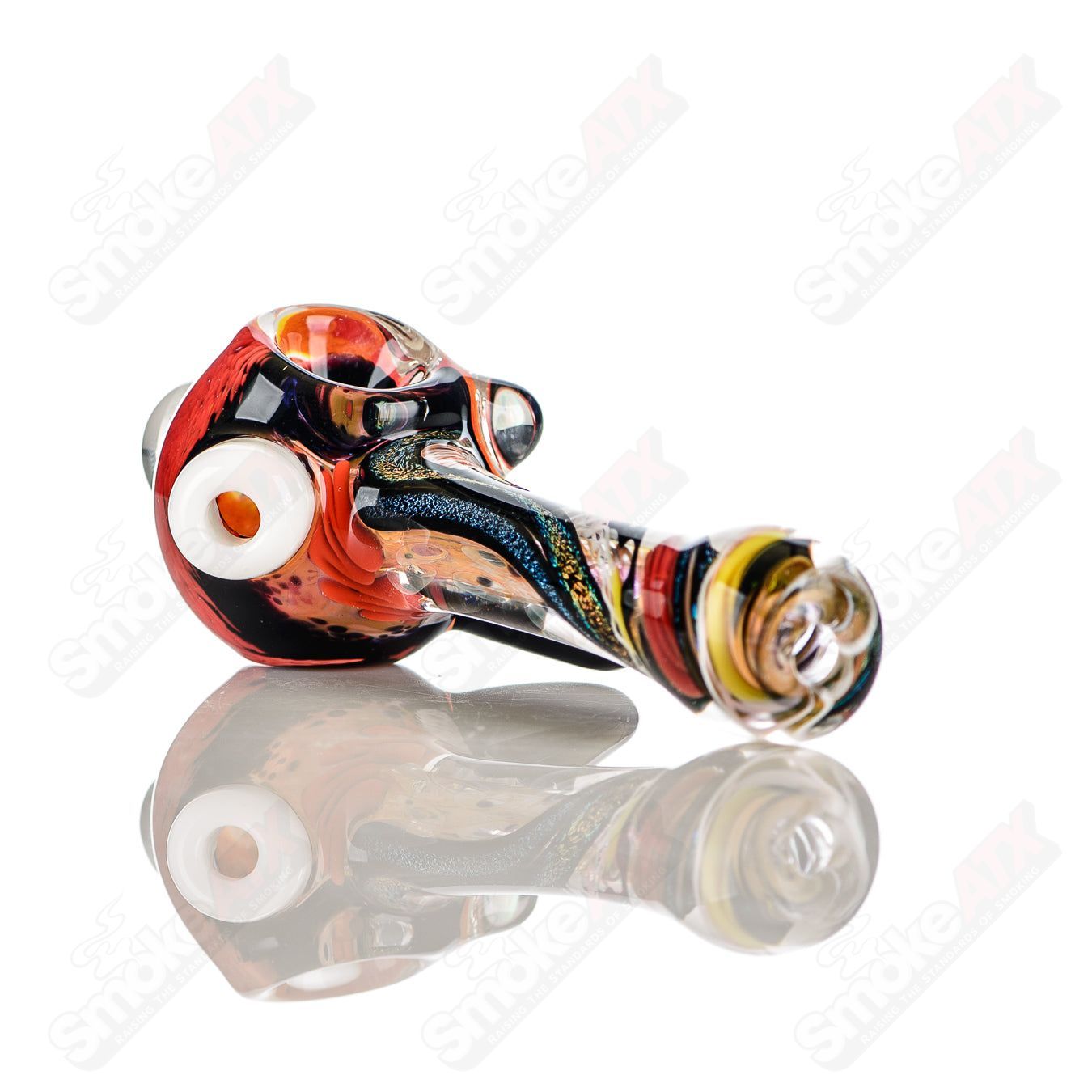 Colorfully worked IO spoon hand pipe by Jeremy from Oregon with 18 vibrant colors and intricate glass design.