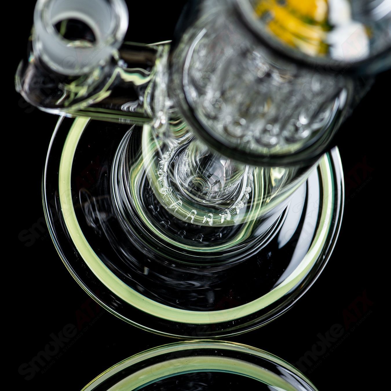 Toro Glass 18mm circle to 13-arm perc concentrate rig with reversal sections, featuring intricate glasswork and multiple filtration chambers.