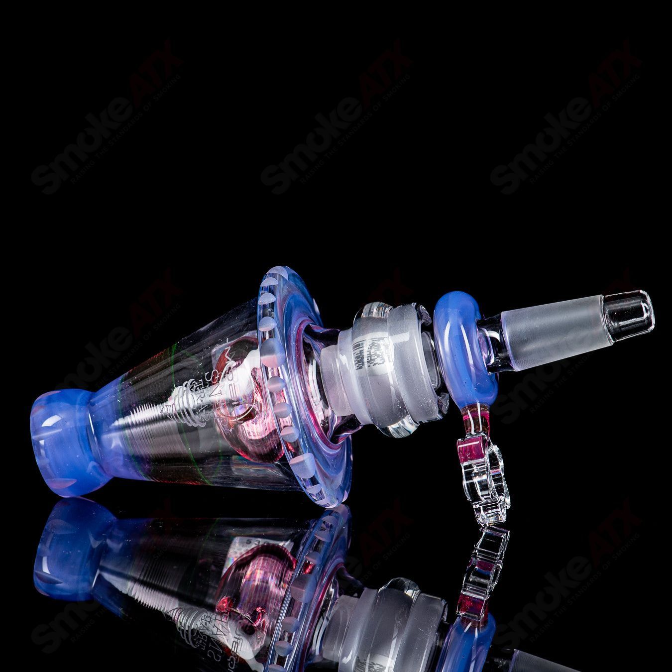 Mobius 19mm Elements Snap Trap fitting for heady glass ash catchers, showcasing the clear glass and trap design.