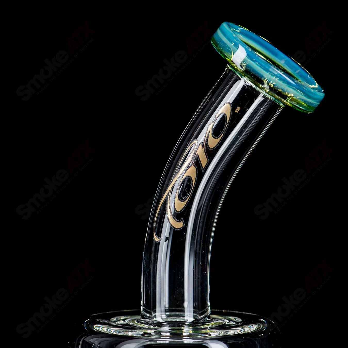 Toro Glass 14mm Double Macro XL bubbler with color accents, featuring a clear glass body and intricate design details.