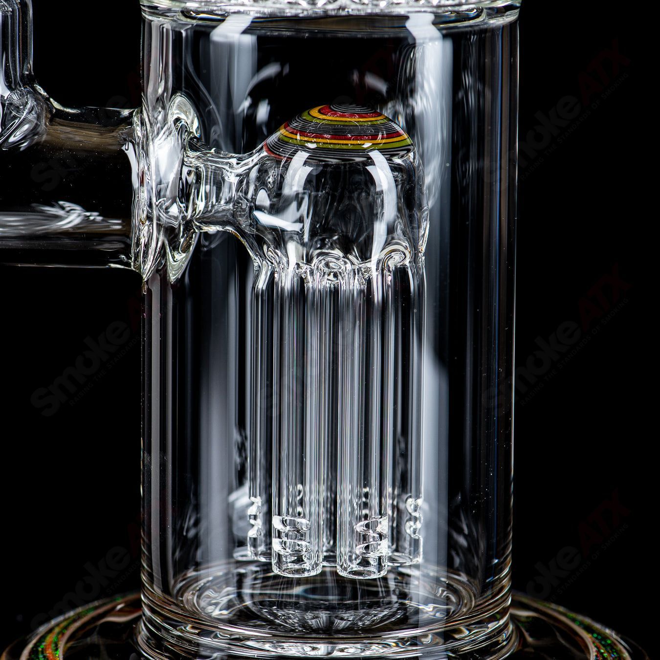 Toro 18mm 7/13 arm perc glass straight tube with worked sections, featuring intricate glasswork and clear Toro branding.
