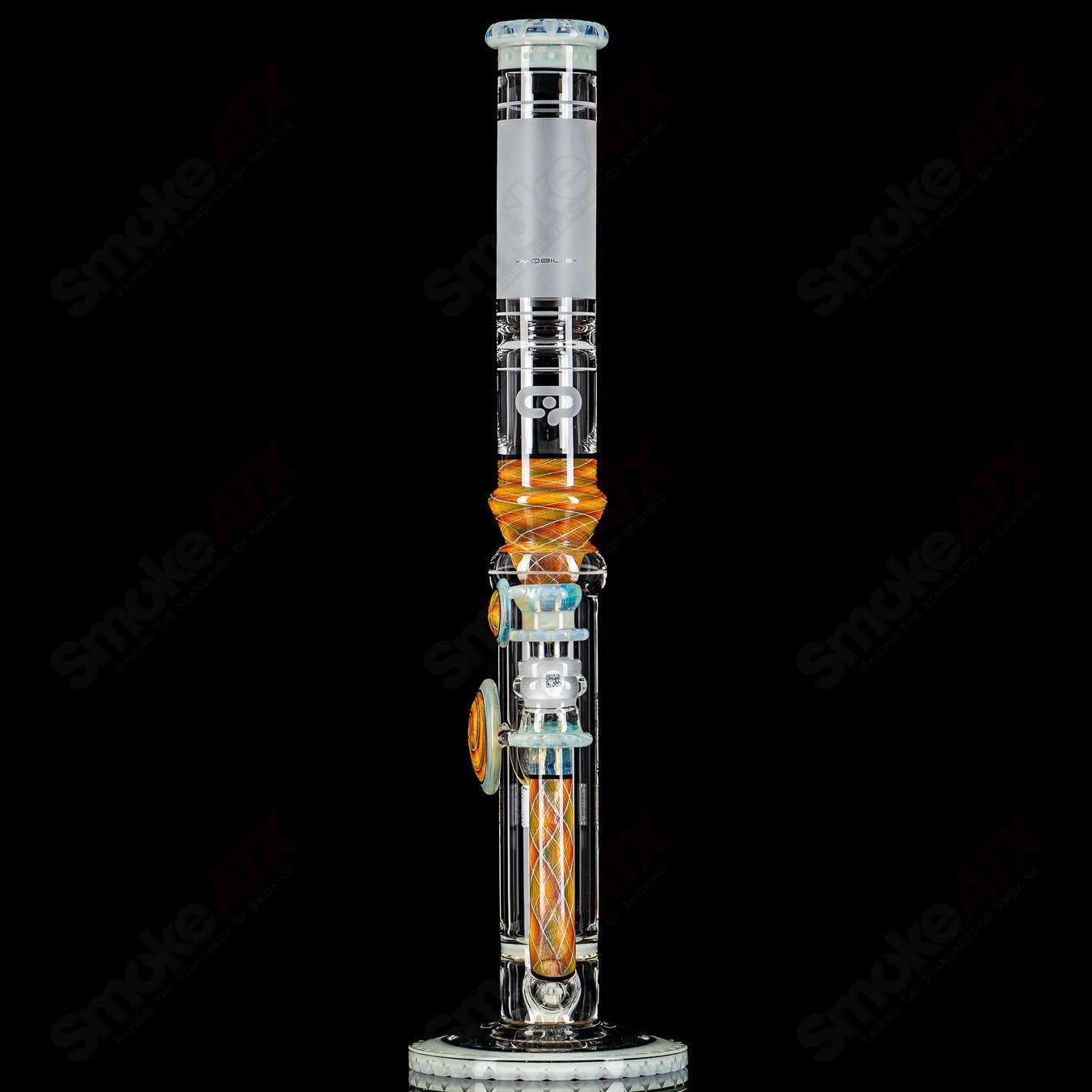 Glass waterpipe with splash trap elements, Mobius #2 45 T V1 model, featuring intricate glass design and removable components.