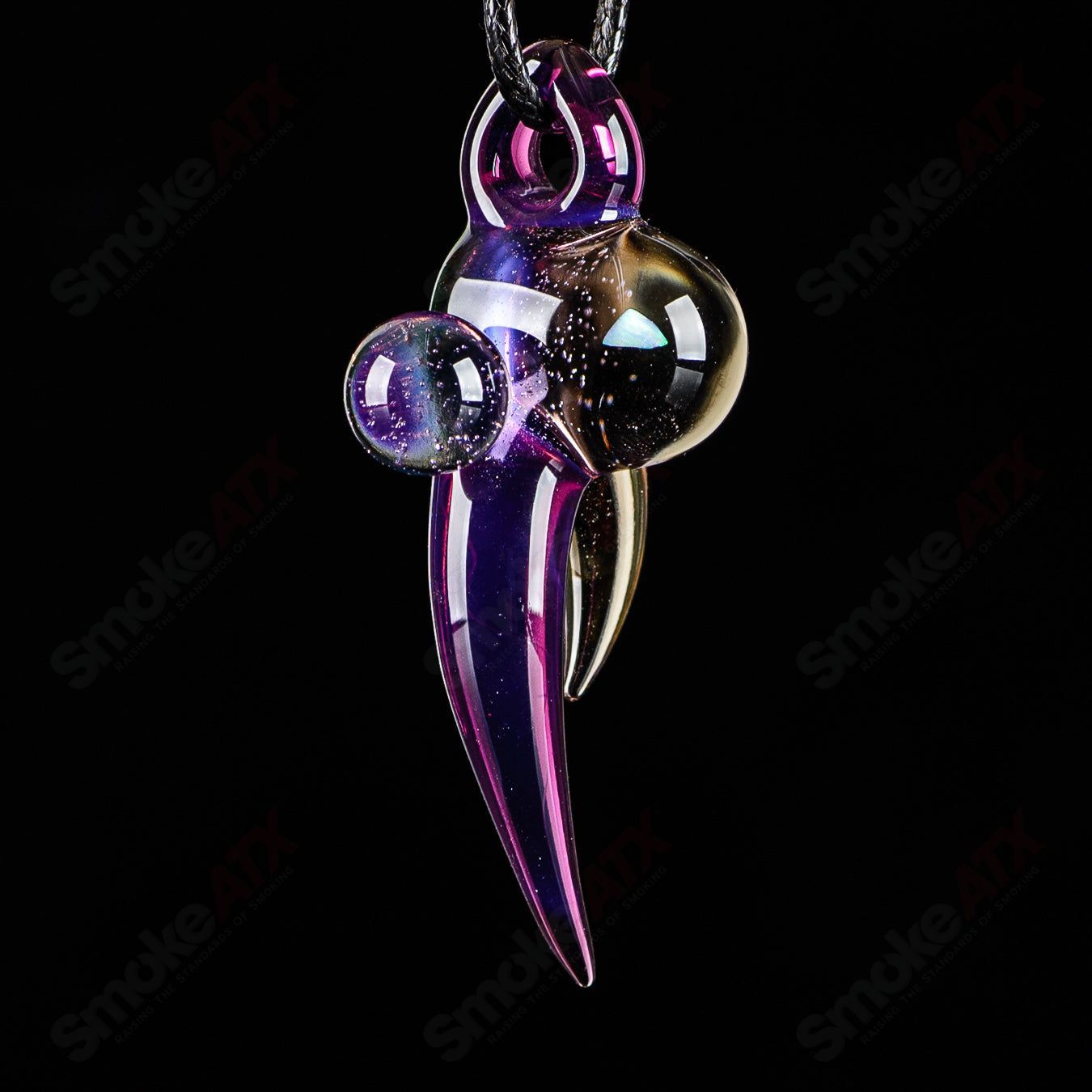 Dosh Glass #2 Amulet Pendant made of Dosh Glass, featuring intricate glasswork and a pendant design on a clear glass background.
