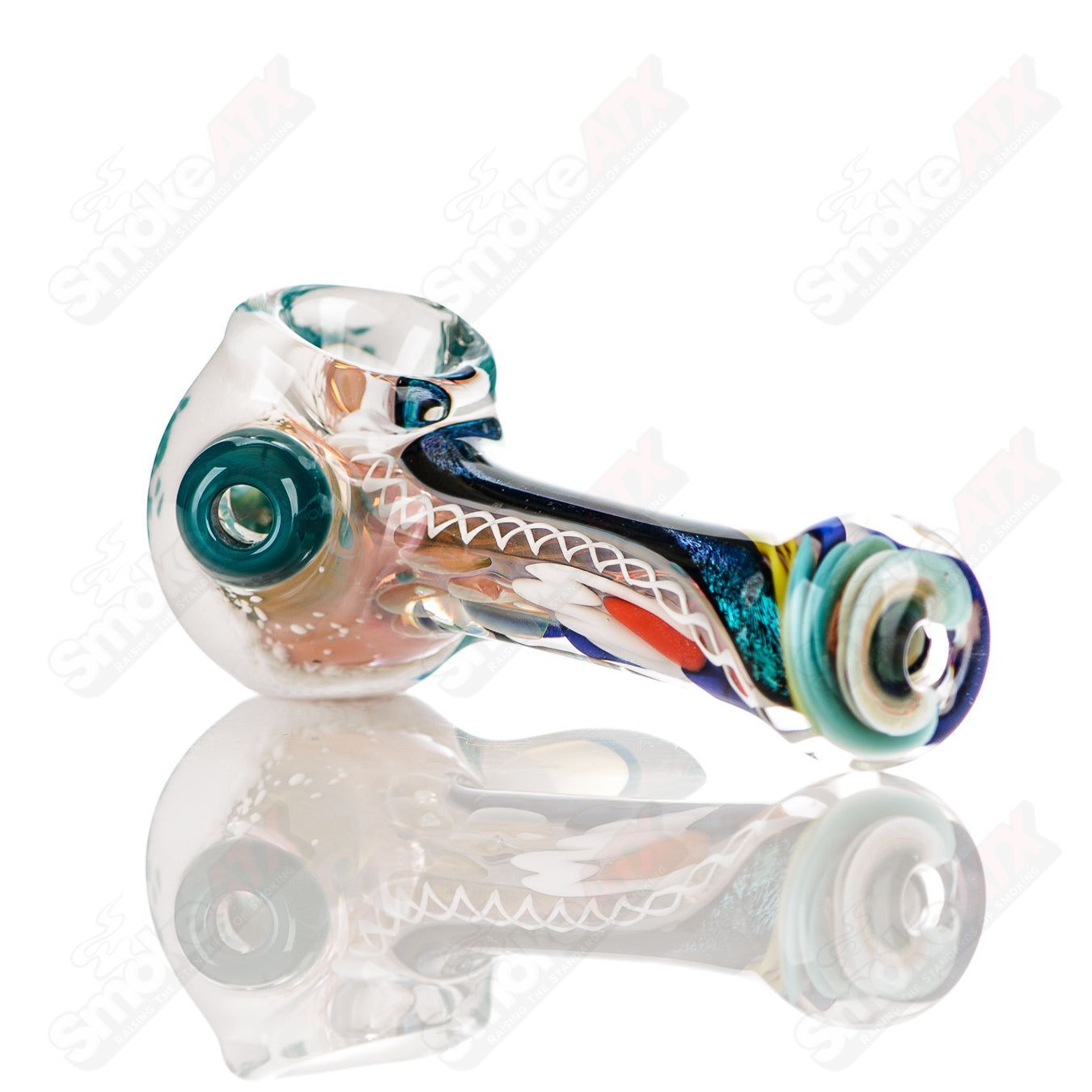 Colorfully worked IO spoon pipe by Jeremy from Oregon, handcrafted heady glass hand pipe with vibrant two-tone design.
