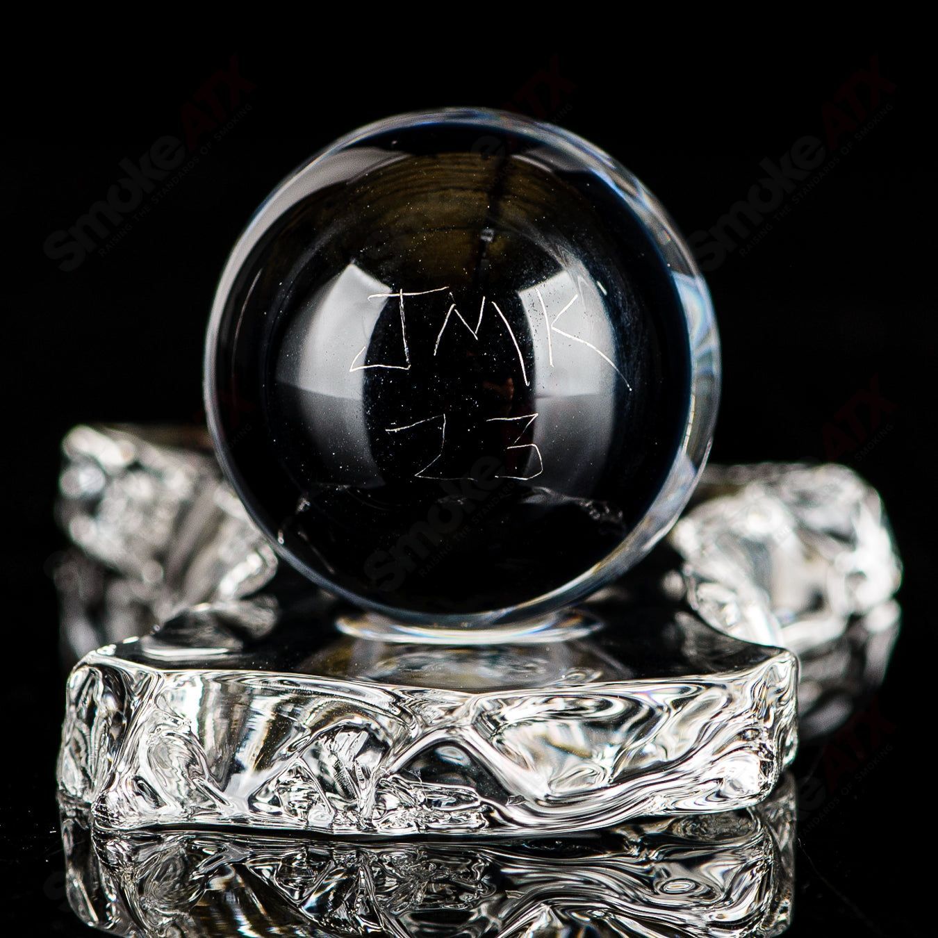 Fume Latticino Marble signed by JMK Glass, a colorful heady glass marble with intricate latticino patterns and swirling design.