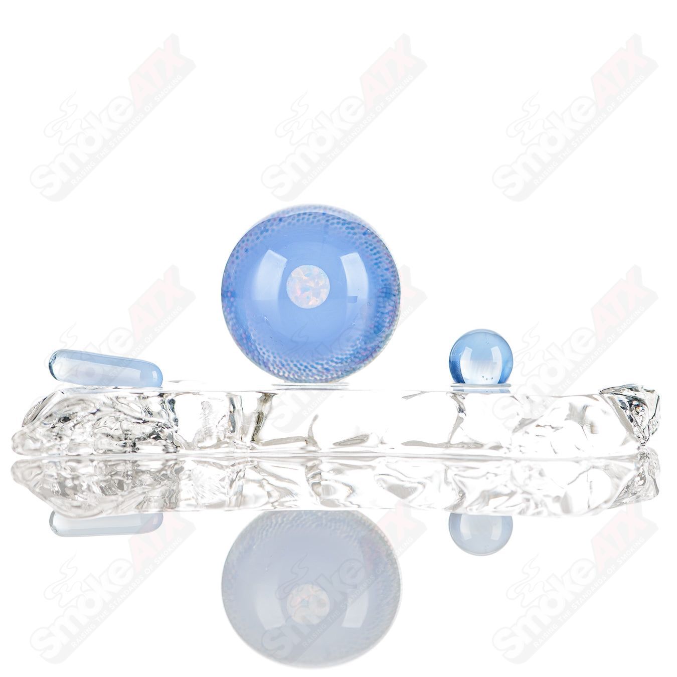 JH Glassworks geometric slurper marble featuring colorful, intricate glass patterns and a smooth, rounded shape.