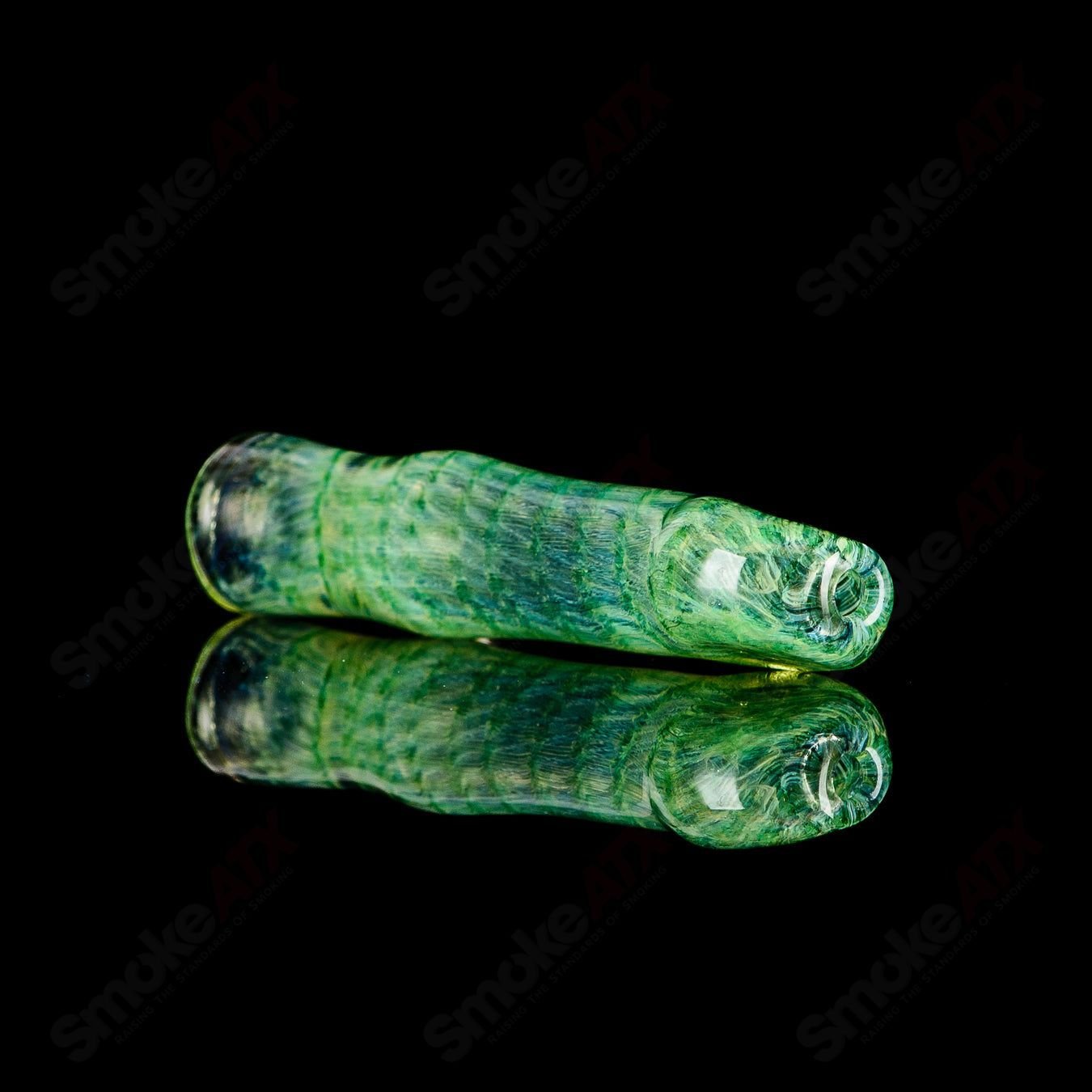 Signed JMK Glass I/O Worked Chillum, clear glass smoking pipe with intricate design and signature detail, 2-inch length.