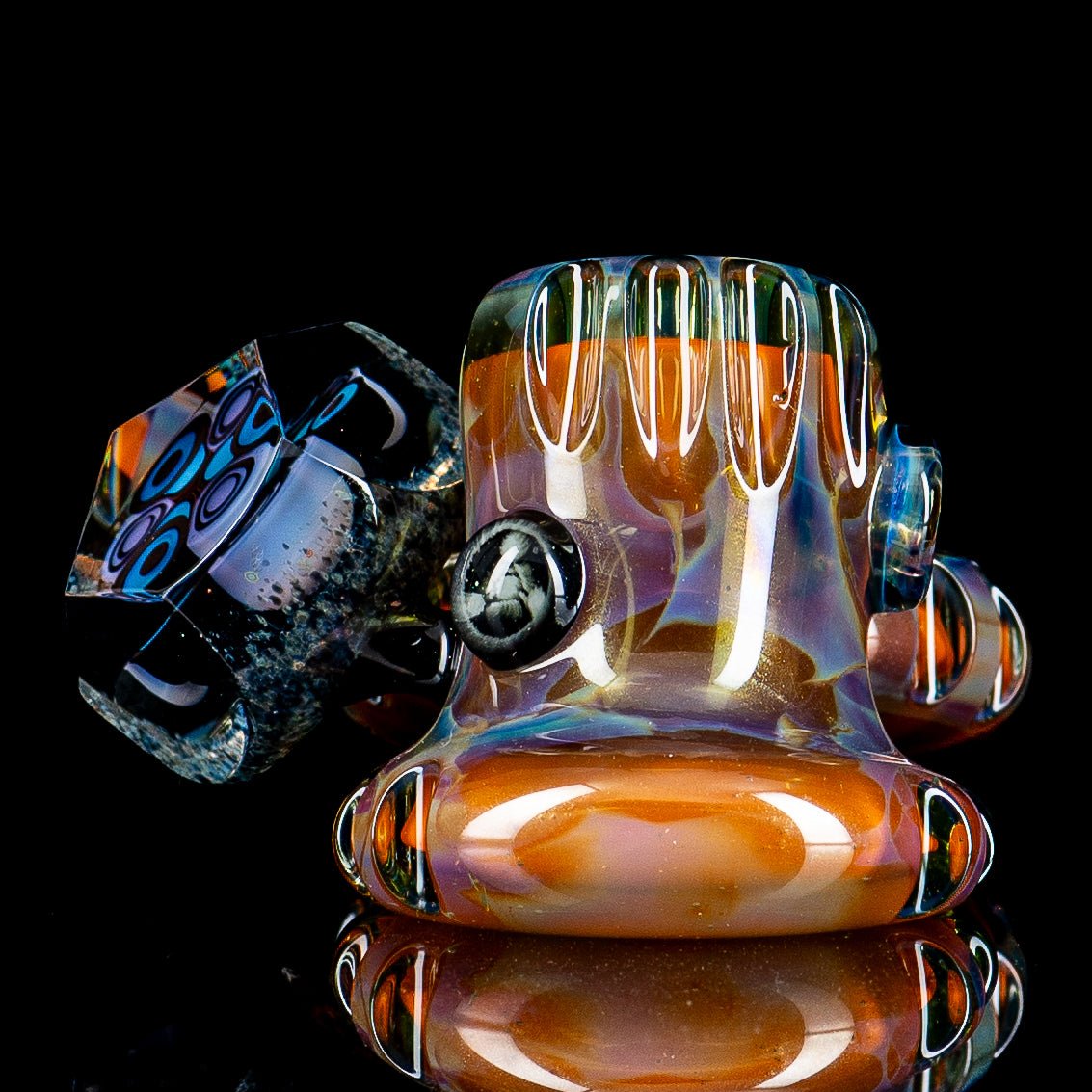 Hand pipe by Rotational Science featuring a colorful dottacello design with two pockets in vibrant heady glass style.