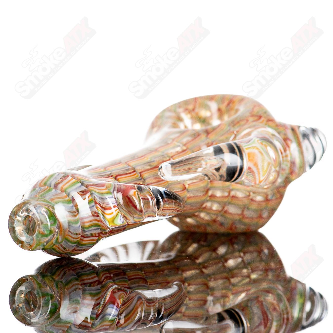 JMK Glass Sceptre Steam Roller Spoon hand pipe made of clear glass with detailed design, perfect for smoking sessions.