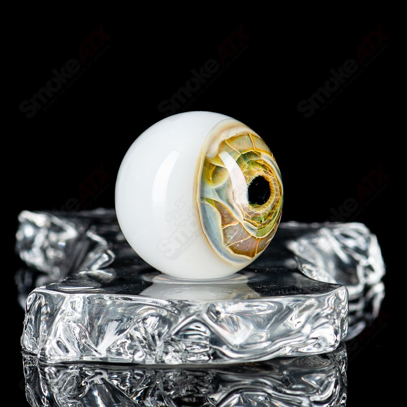 Colorful Indo Glass skull eye Mili top heady glass with marbles, featuring detailed skull and eye designs.