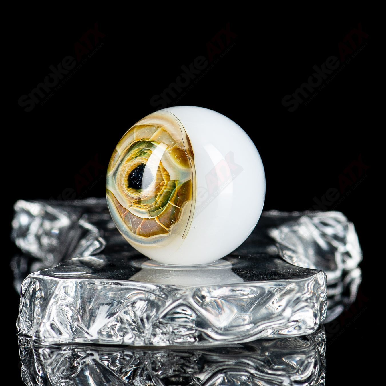 Indo Glass Skull Eye Mili Top MIB hexy heady glass piece with colorful marble accents and skull and eye designs.