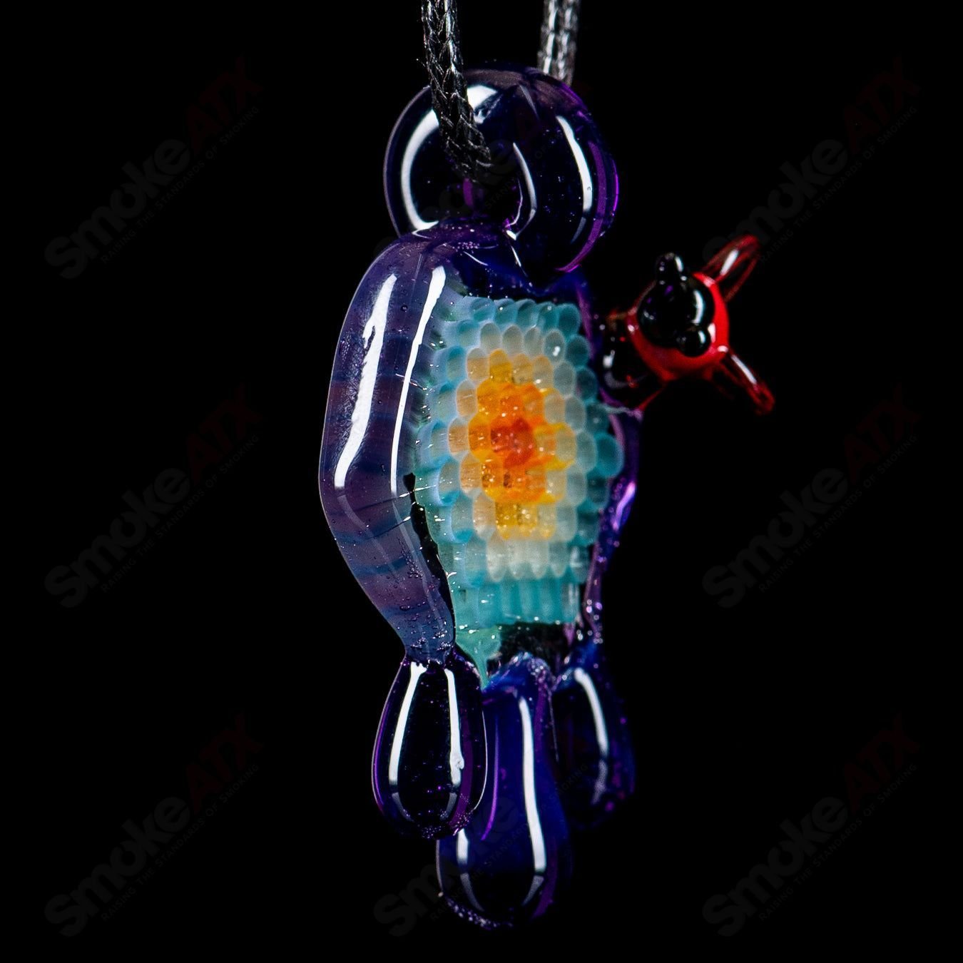 Small colorful honeycomb drip pendant by Joe P Glass, handcrafted heady glass jewelry with vibrant design and intricate details.