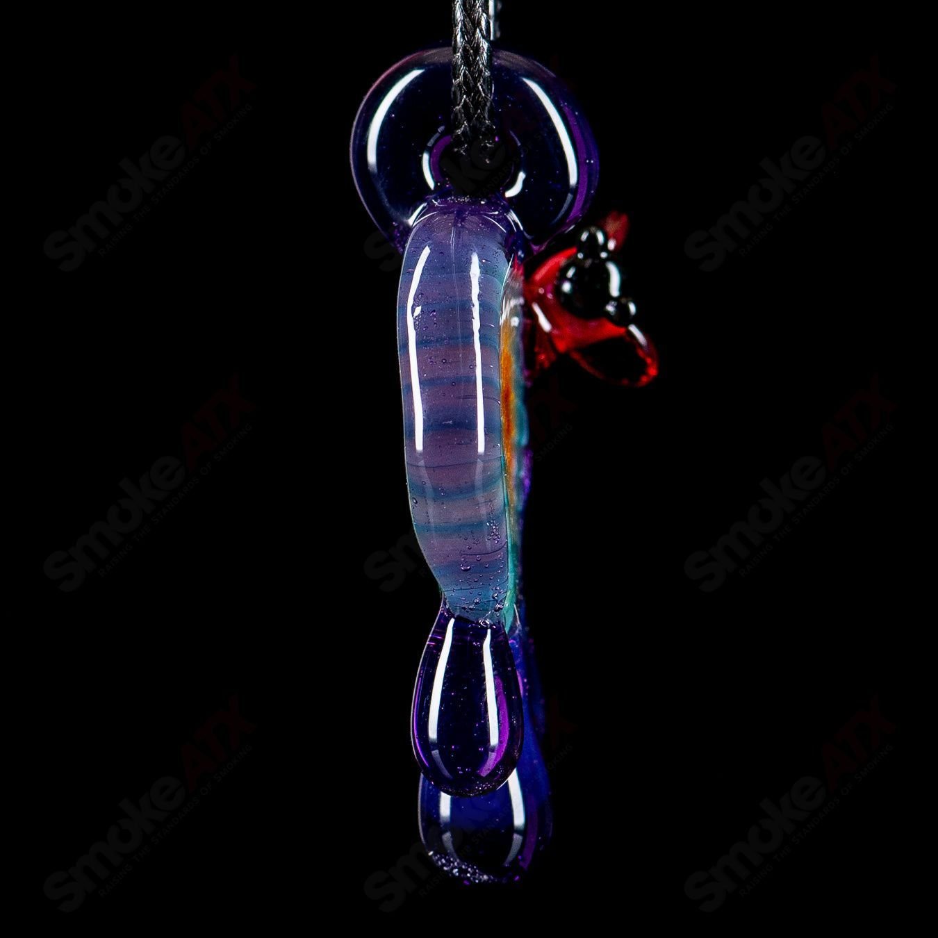 Small colorful honeycomb drip pendant by Joe P Glass, handcrafted heady glass jewelry with vibrant design and intricate details.