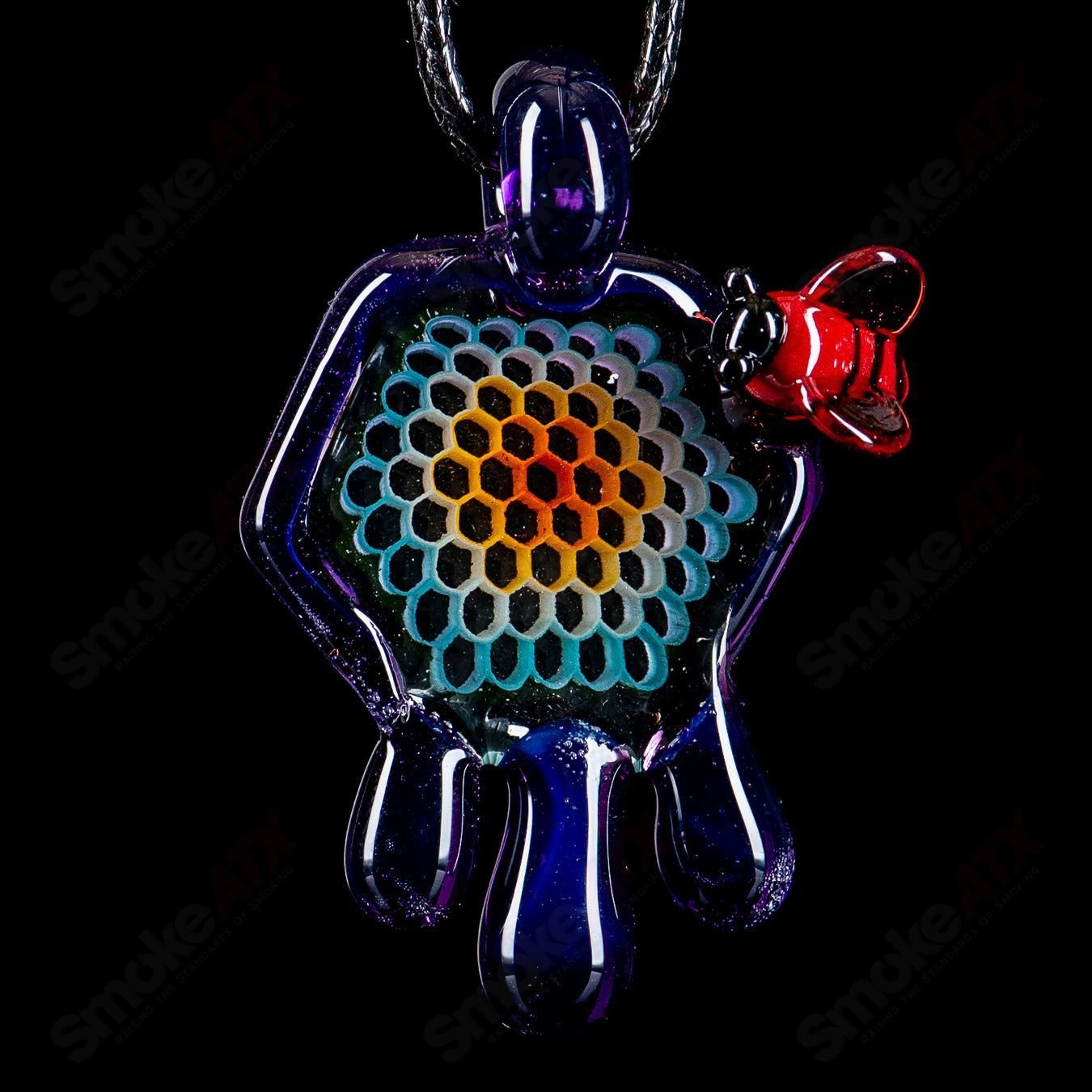 Small color honeycomb drip pendant in vibrant hues by Joe P Glass, featuring intricate glasswork and a sleek pendant shape.