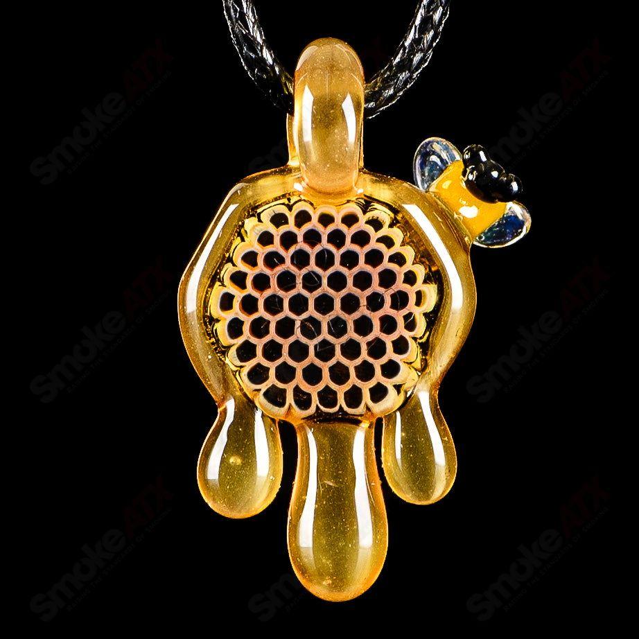 Small honeycomb drip pendant by Joe P Glass, colorful heady glass pendant with intricate honeycomb design for jewelry or display.