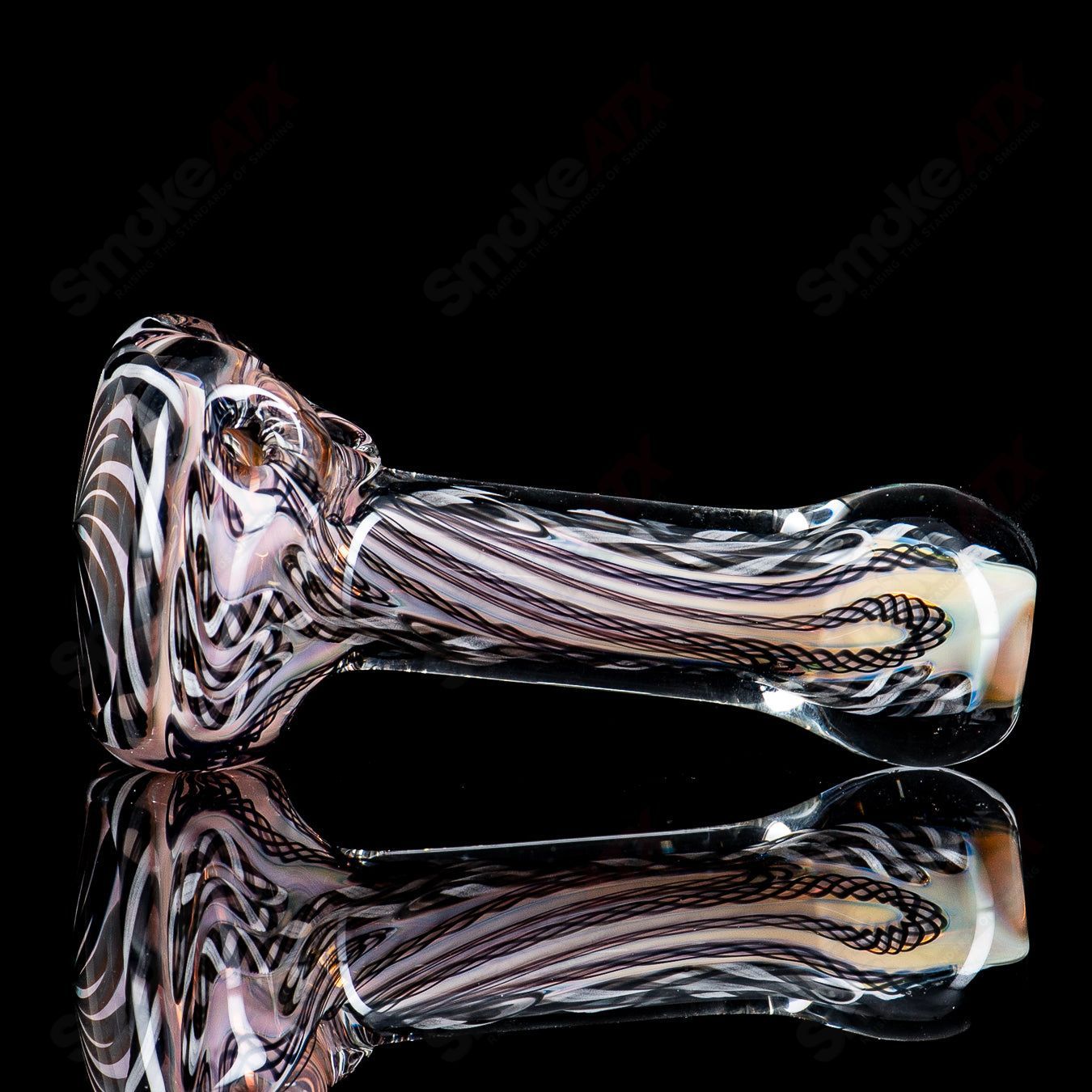 Clear glass pipe with a solid cane and latti spoon design by Talent Glass Works, featuring intricate glasswork and a smooth bowl.