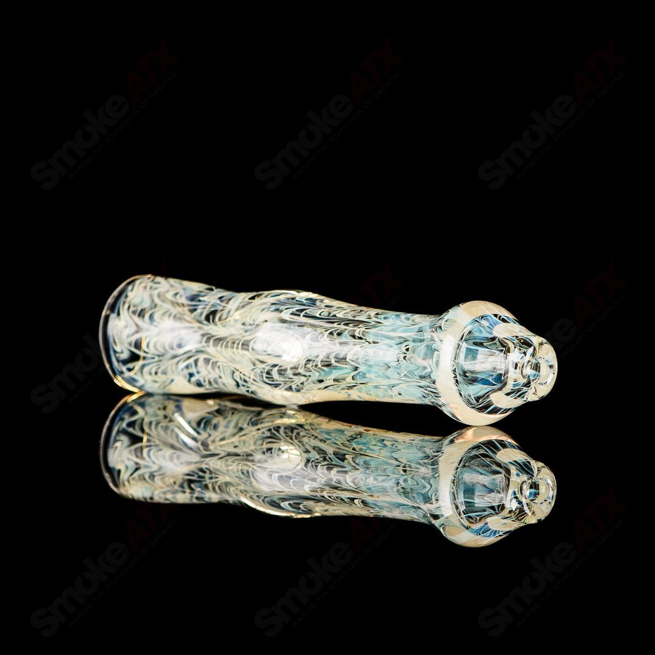 JMK Glass transparent worked chillum with clear dot signature, showcasing detailed glass craftsmanship.