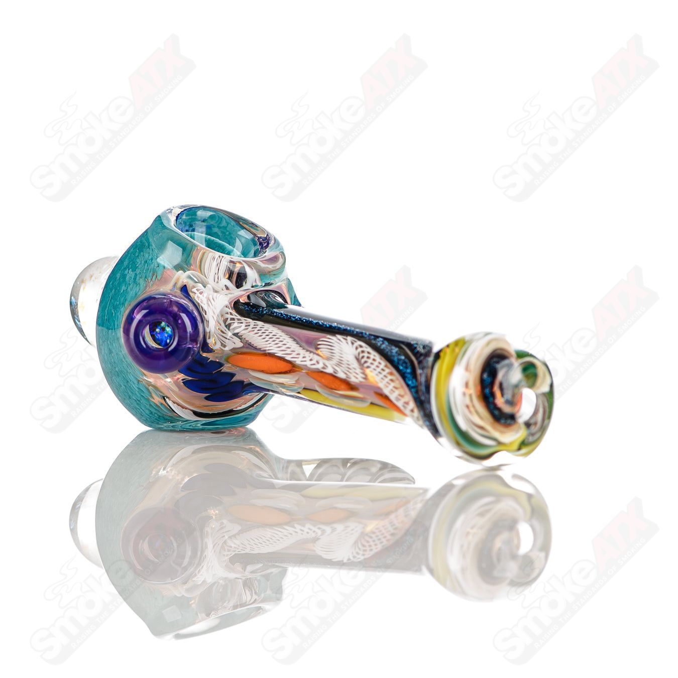 Colorfully worked IO spoon pipe by Jeremy from Oregon, handcrafted heady glass hand pipe with vibrant 20-color design.