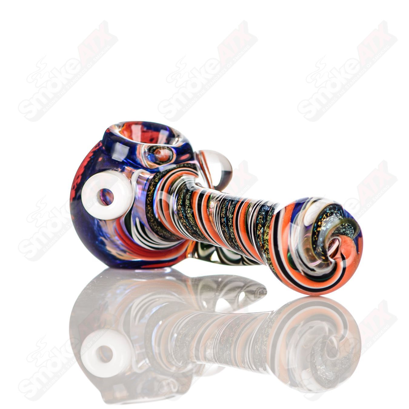 Colorfully worked IO spoon hand pipe by Jeremy from Oregon, featuring intricate 21-color design and smooth glass craftsmanship.