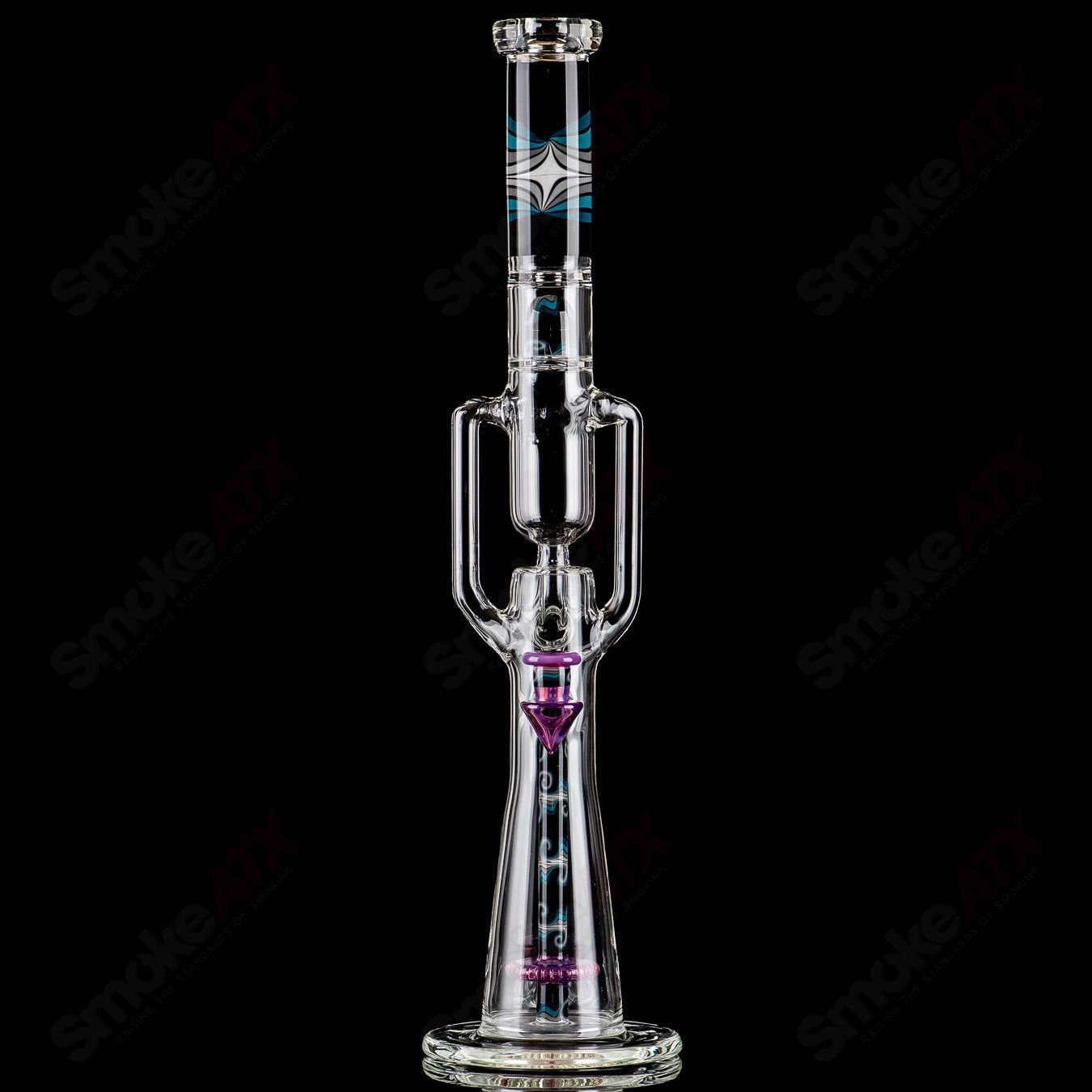 21-inch Zyklon Recycler by Mad Rob Glass, a colorful heady glass recycler with intricate swirl patterns and a clear glass body.