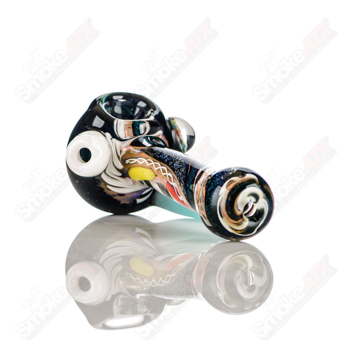 Colorfully worked IO spoon hand pipe by Jeremy from Oregon, featuring vibrant 23-color design and intricate glass artwork.