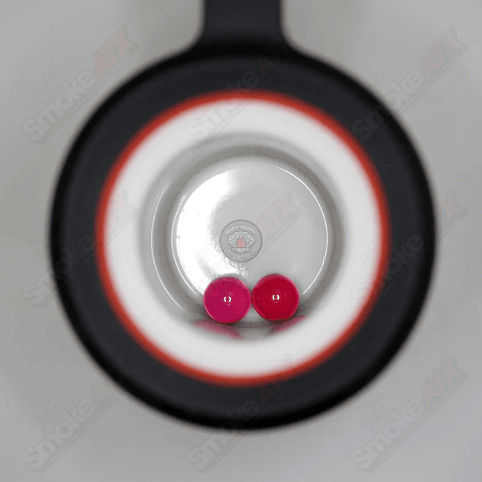 Two packs of 4mm ruby-colored glass pearls from Ruby Pearl Company, showcasing smooth, shiny pearl beads for jewelry making.