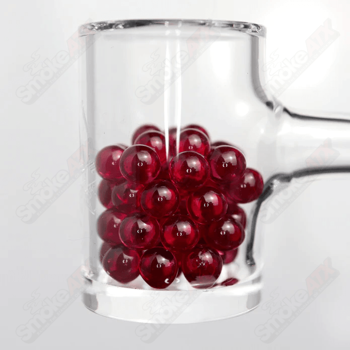 Two 5mm glass ruby pearls from Ruby Pearl Company, round and shiny, suitable for jewelry making and craft projects.