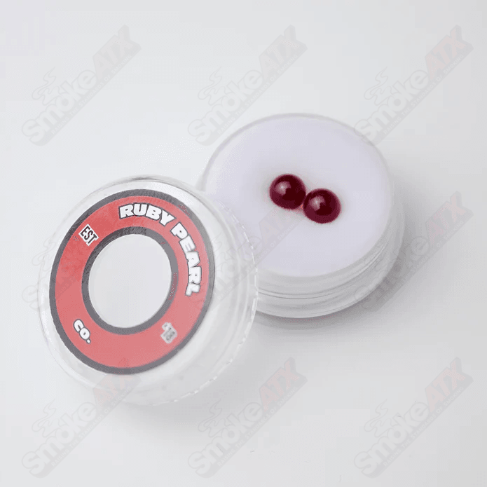Two 5mm Ruby Pearls from Ruby Pearl Company, glass pearls with a rich red color and smooth, rounded surface.