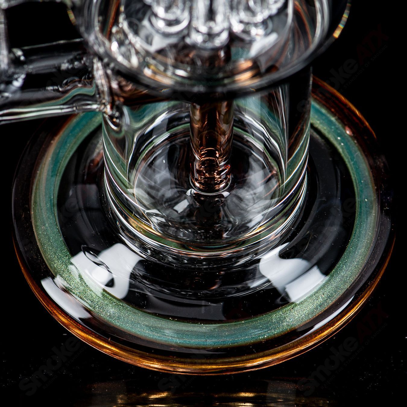 Toro Glass 10mm double macro concentrate rig with colorful caps, featuring intricate heady glass design and clear glass accents.