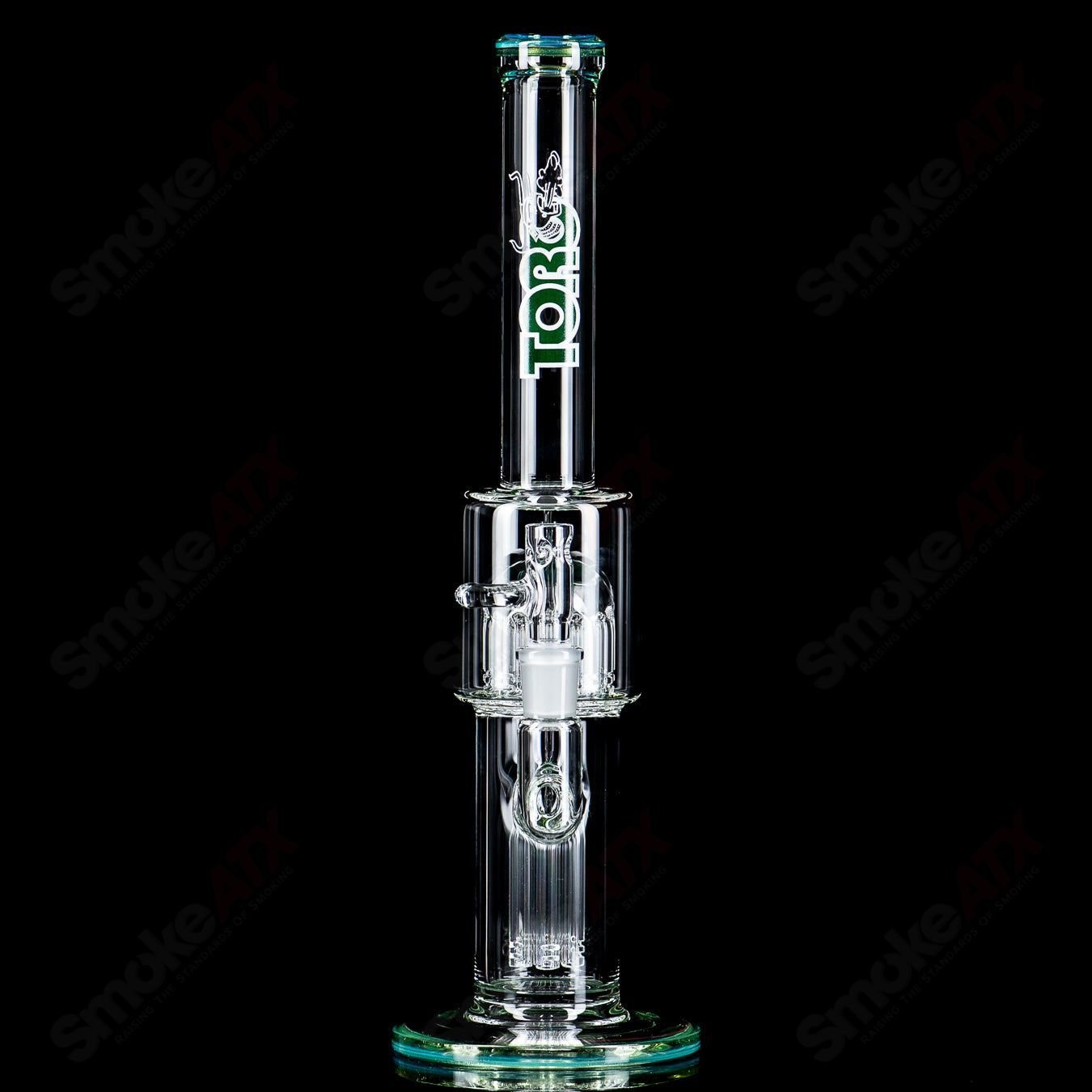 Toro 14mm straight glass bong with 7 to 13-arm perc and colorful cap, designed for smooth filtration and aesthetic appeal.