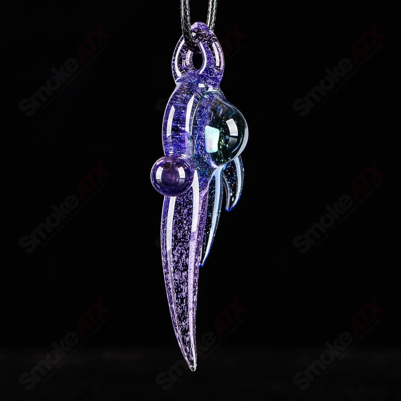 Dosh Glass #3 Amulet Pendant made of colorful Dosh Glass with intricate designs, hanging as a decorative heady glass pendant.