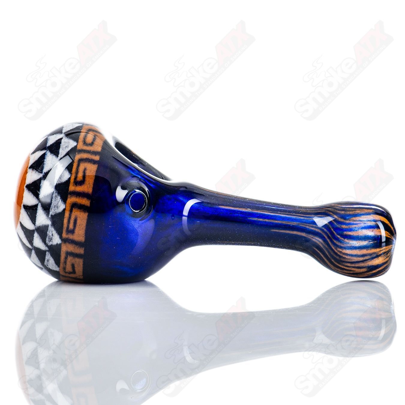 Glass pipe shaped like a classical spoon in orange and blue, designed by Steve Hoffman, with a smooth, curved bowl and clear glass finish.
