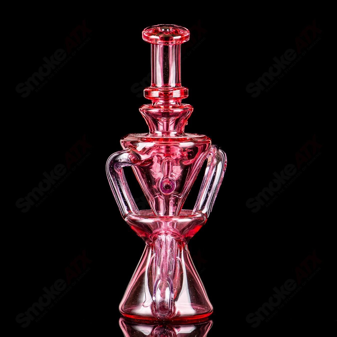 Mini recycler glass pipe by Captn Chronic featuring a heady design and clear glass construction, perfect for smooth smoking sessions.