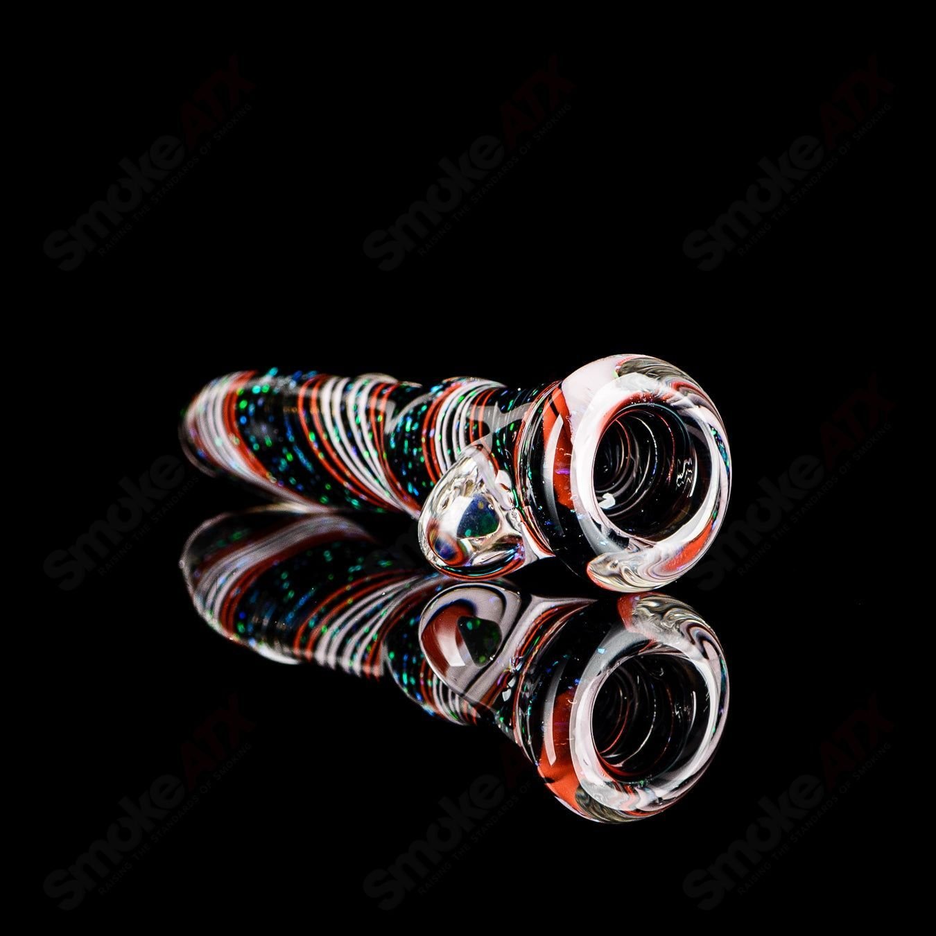 Glass chillum named Opal Hitter by Rotational Science, featuring a colorful opal design and smooth, rounded shape.