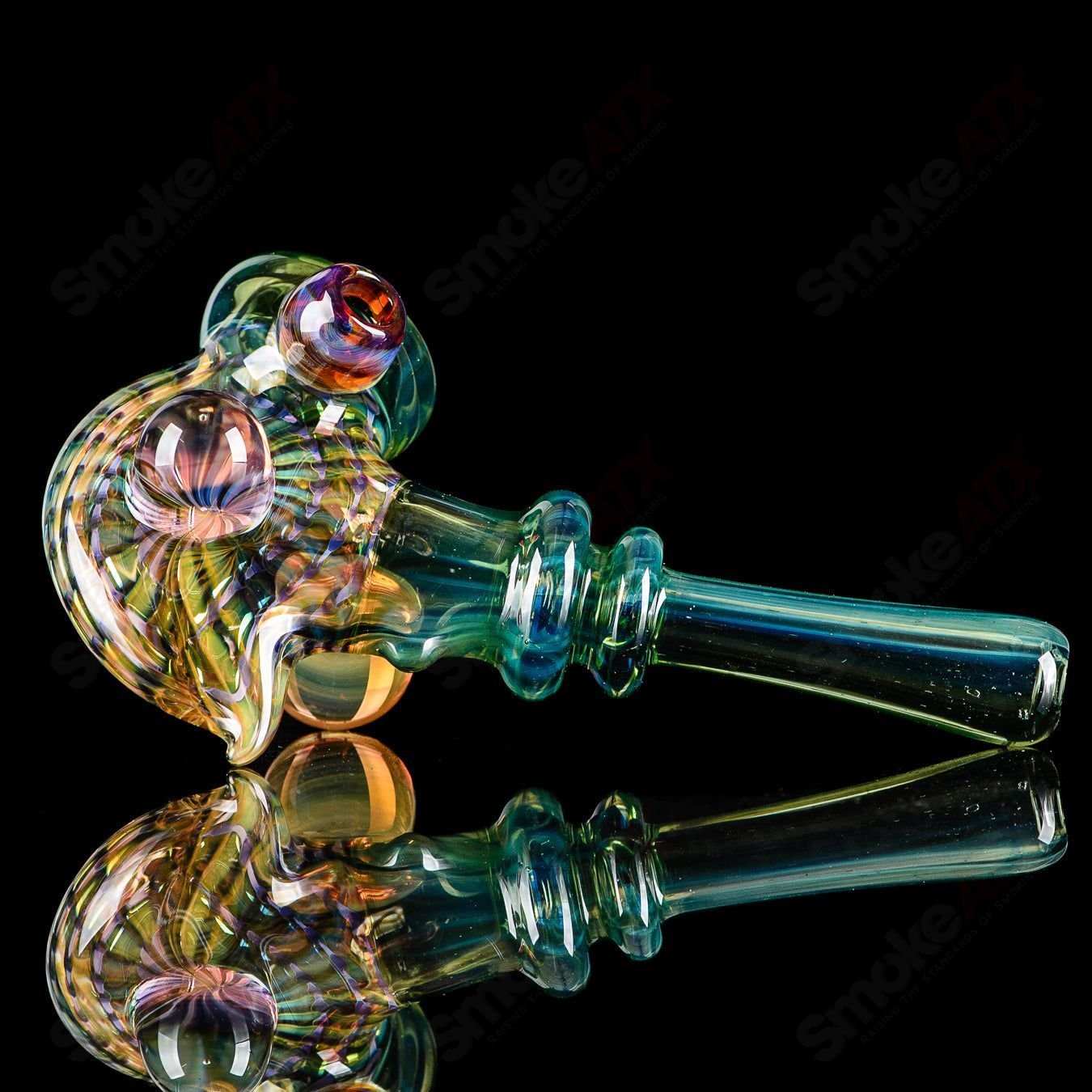 Dosh Glass Phantom Spoon Basic hand pipe with clear glass and intricate design for smooth smoking experience.