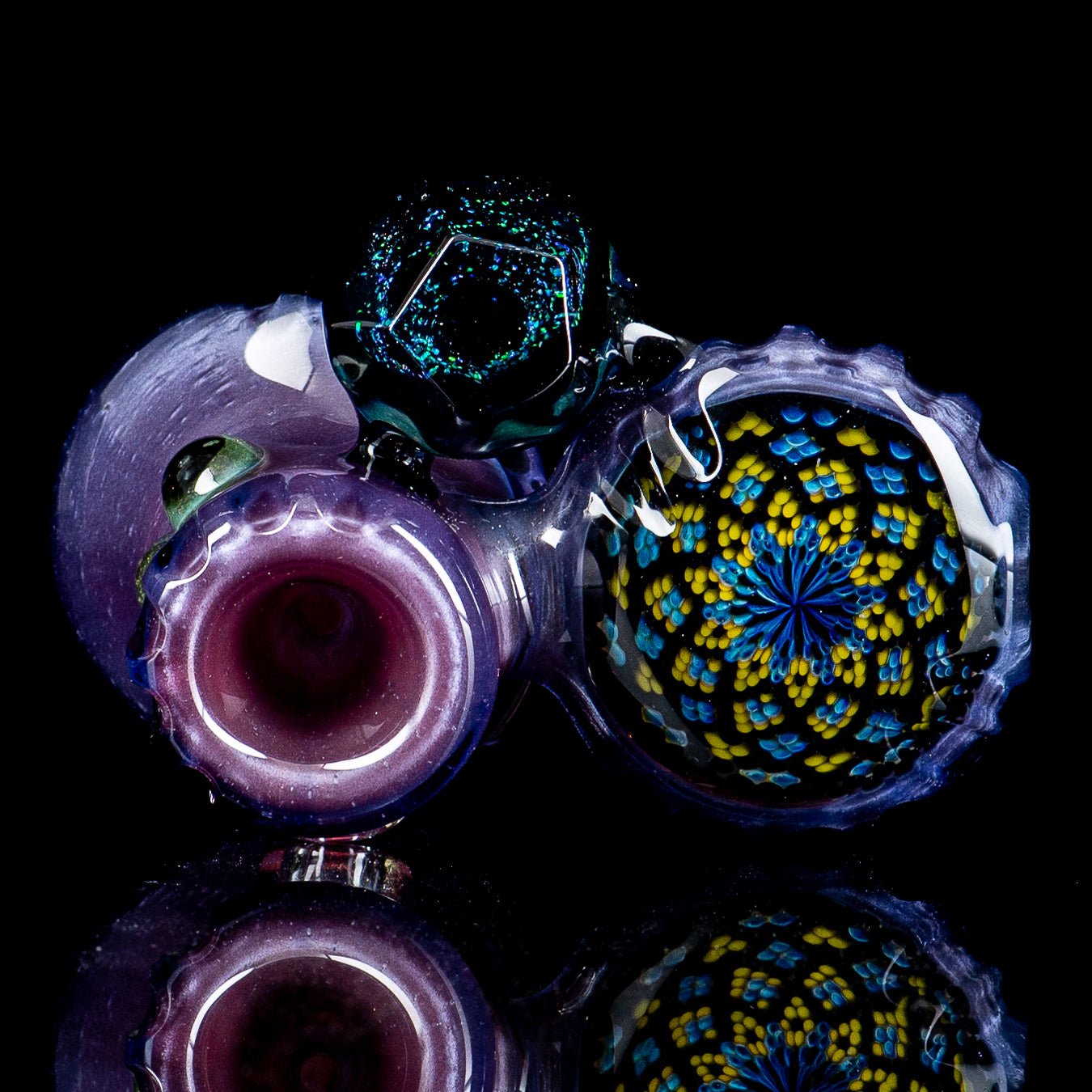 Hand pipe featuring three pockets and colorful dottacello design by Rotational Science, made of heady glass for smooth use.