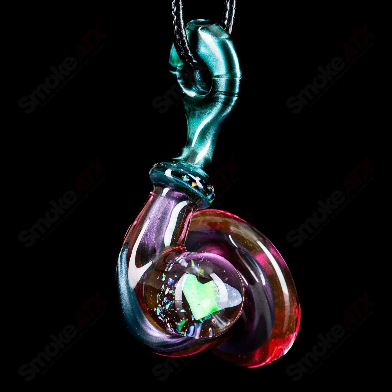 JMass Sherlock pendant featuring a heart-shaped opal gemstone, crafted from clear heady glass, stylish and eye-catching jewelry piece.