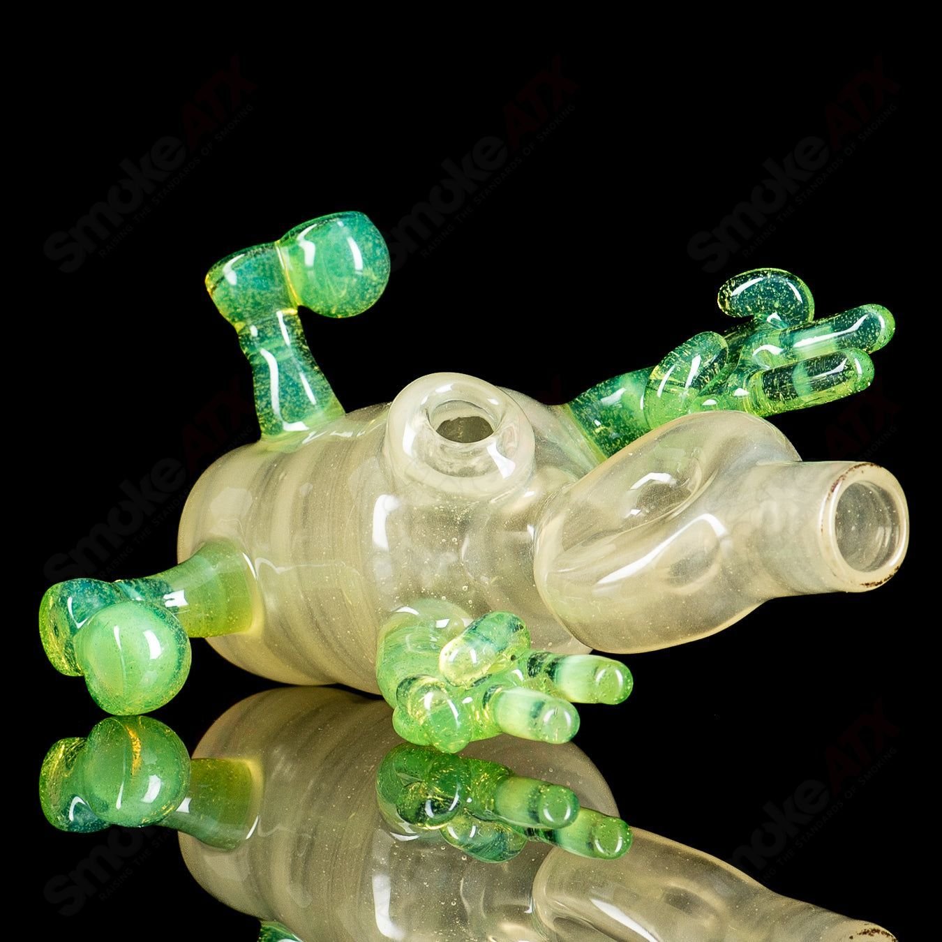 Glass waterpipe rig with a three-sitter design from MJ Meltz, featuring clear glass and detailed craftsmanship.