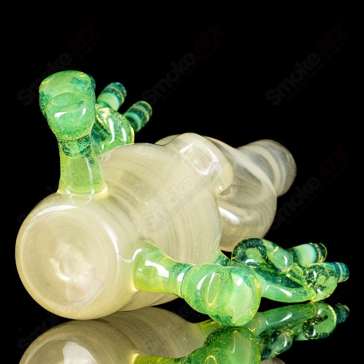 Glass waterpipe rig with three percolators from MJ Meltz, featuring a sleek design and clear glass construction.
