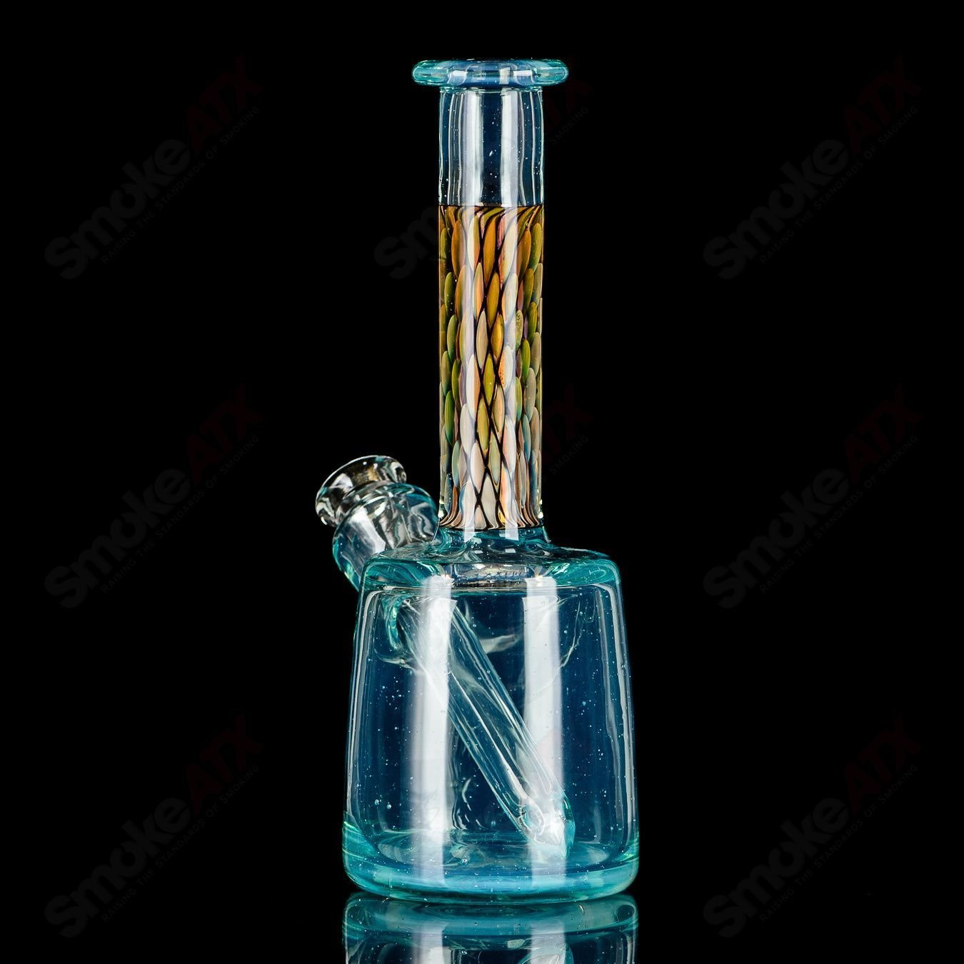 BCM Glass UV Mini Rig, heady glass concentrate rig with colorful UV-reactive glass design and intricate glasswork.