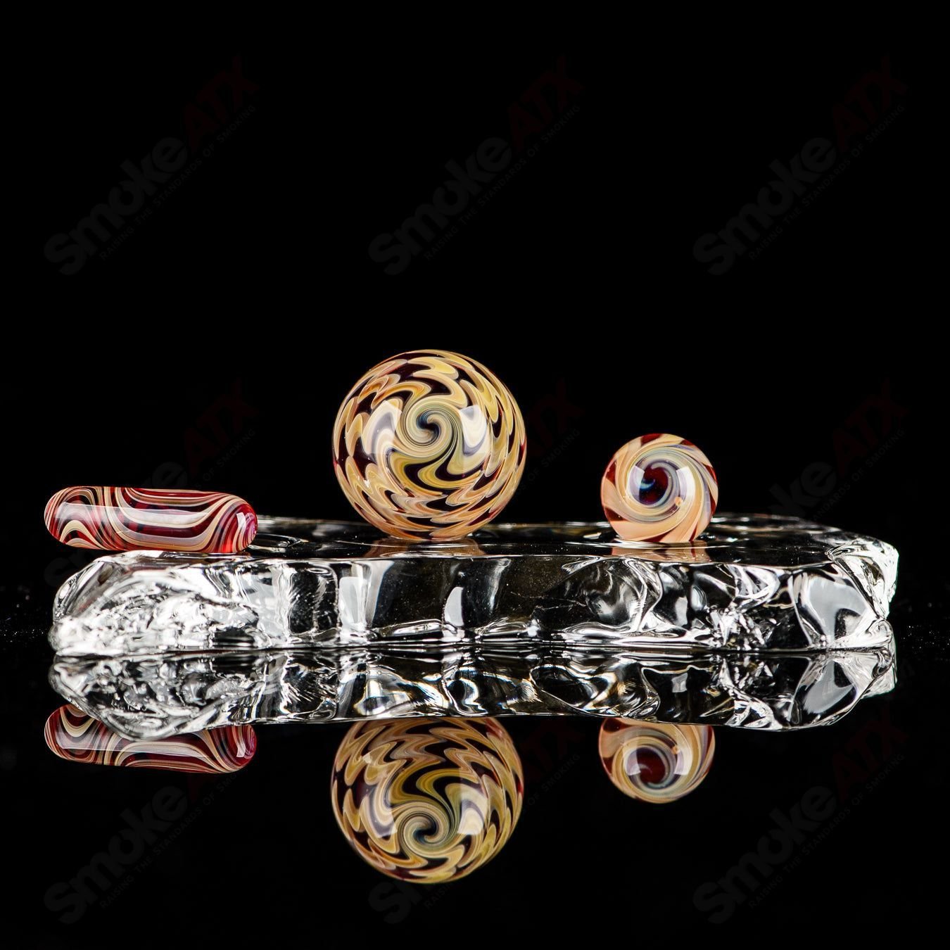 Three-piece UV color worked Indo Glass slurper set in pomegranate, tan, and lava colors, designed for glass accessories.