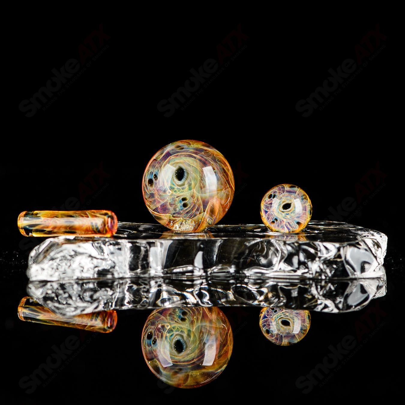 Three-piece UV eye cluster Milli Slurper set by Indo Glass, glass accessories with colorful UV-reactive designs.