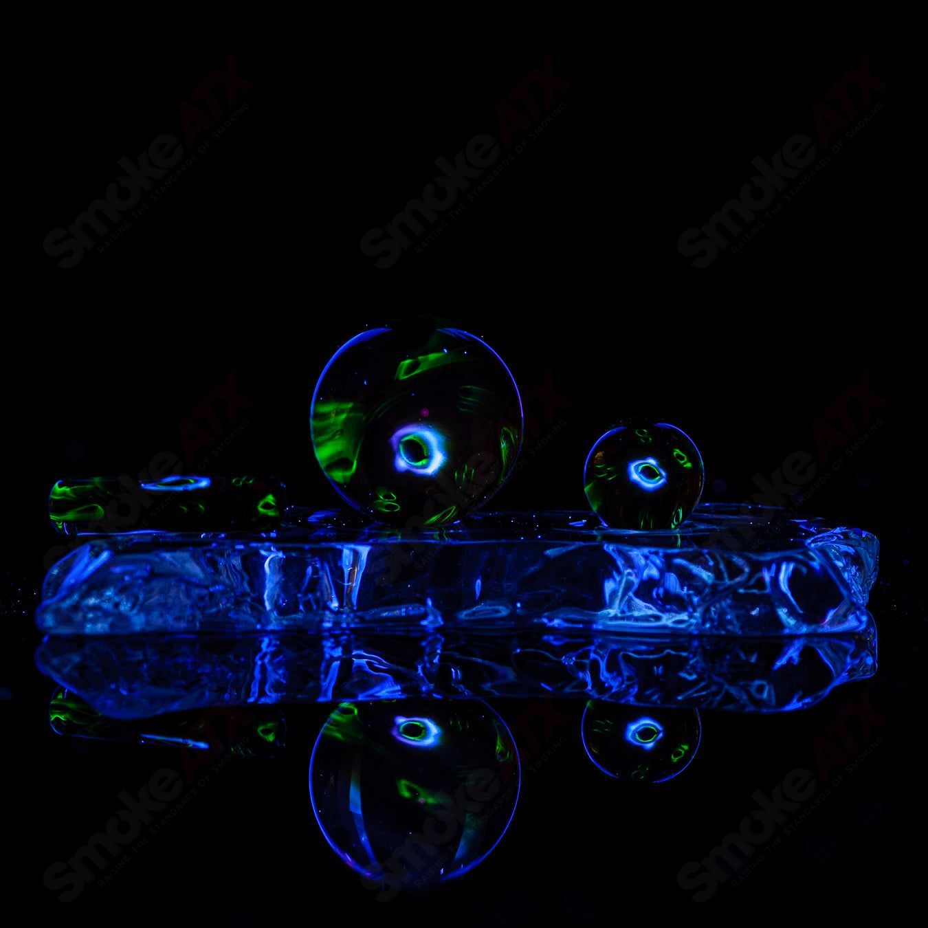 Three-piece UV Eye Cluster Milli Slurper set made of glass by Indo Glass, featuring colorful eye designs and curved mouthpieces.
