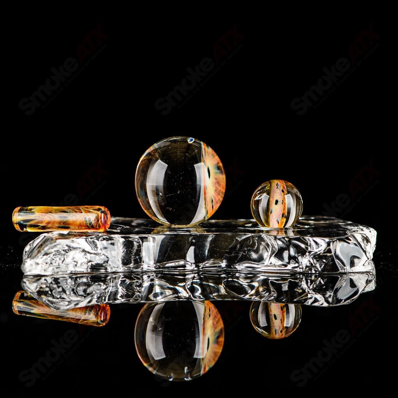 Three-piece UV Eye Cluster Milli Slurper set by Indo Glass, featuring colorful glass accessories for smoking or dabbing.