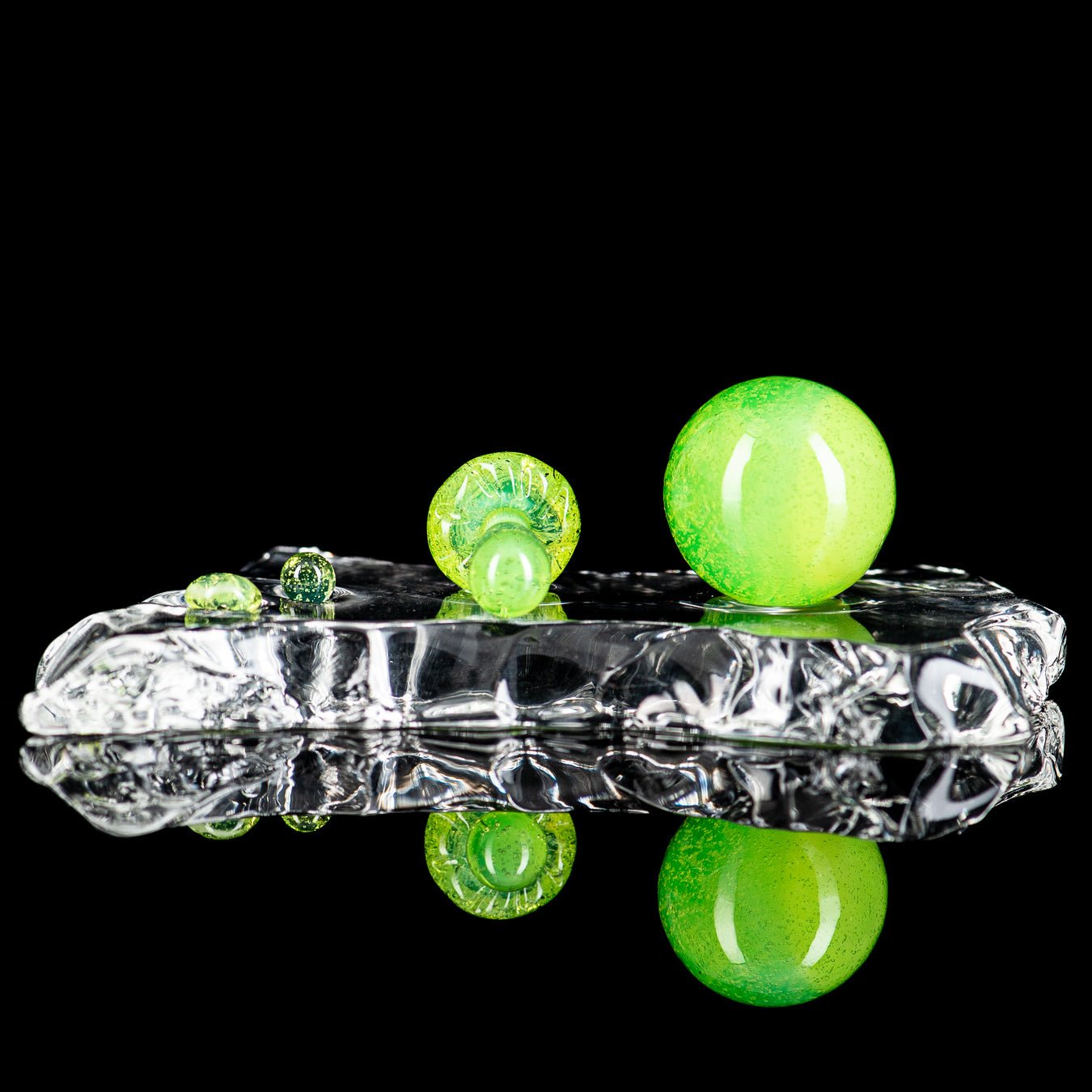 Three-piece UV mushroom terp slurper set by Ganja Grimmlin Glass, featuring colorful mushroom-shaped glass tools for concentrates.