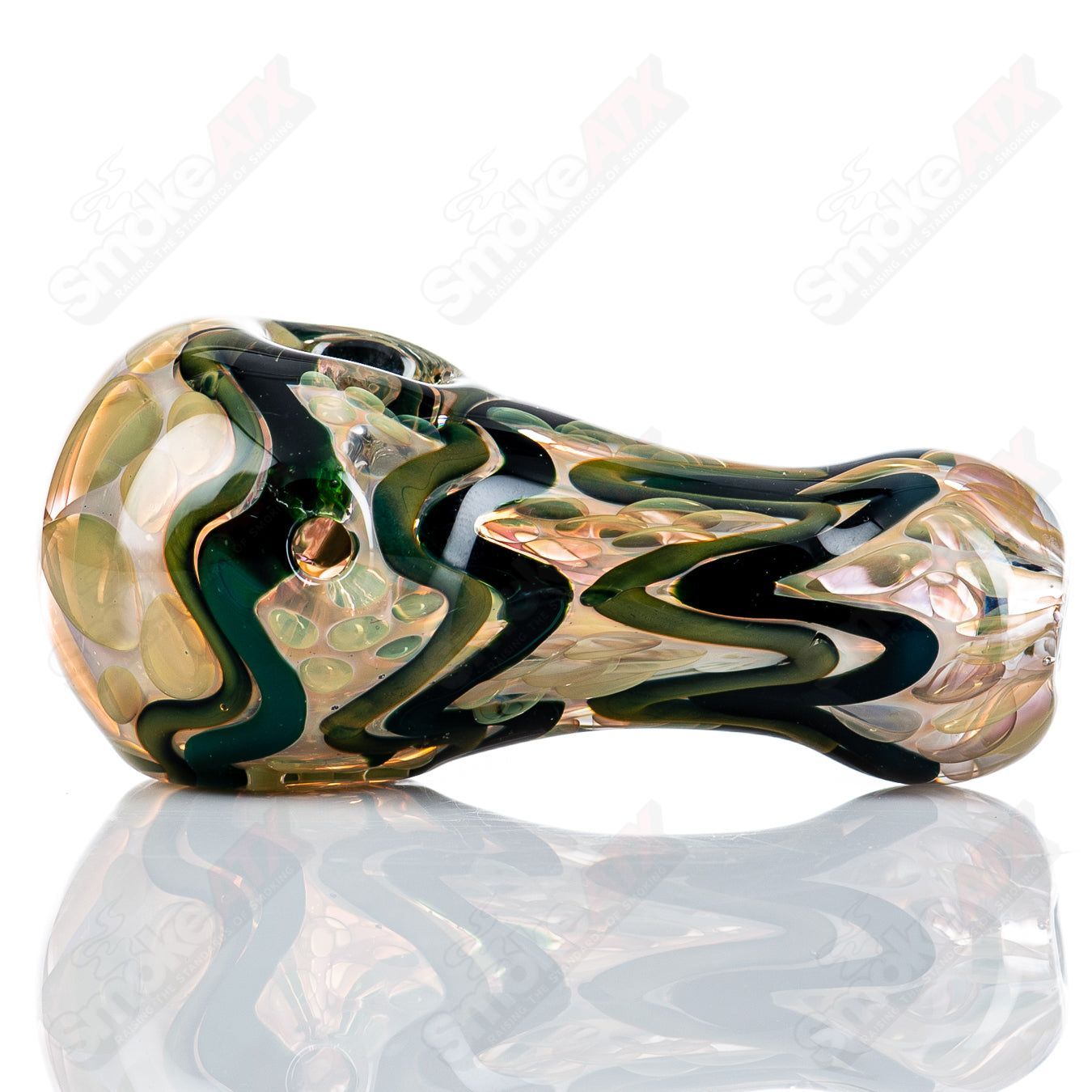 Glass I/O spoon pipe with gold and silver fume accents by Shane Smith, featuring a smooth, rounded bowl and clear glass construction.