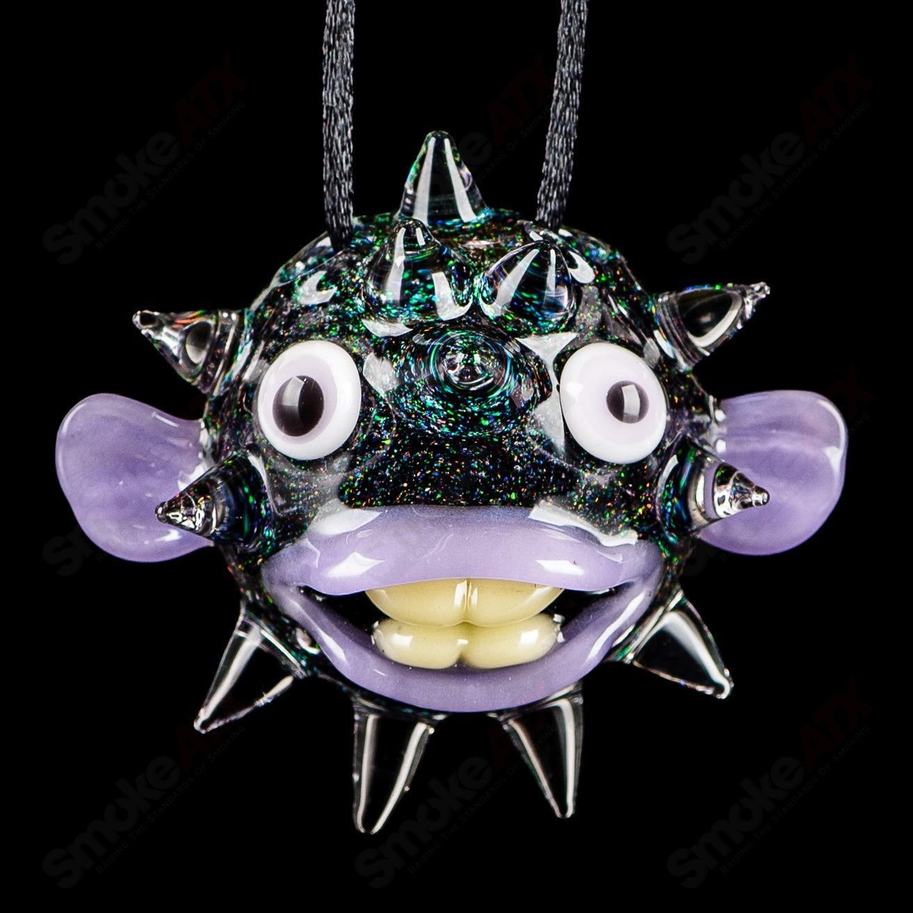 Chadd Lacy Glass four-puffer pendant made of colorful heady glass with intricate design, hanging from a necklace.