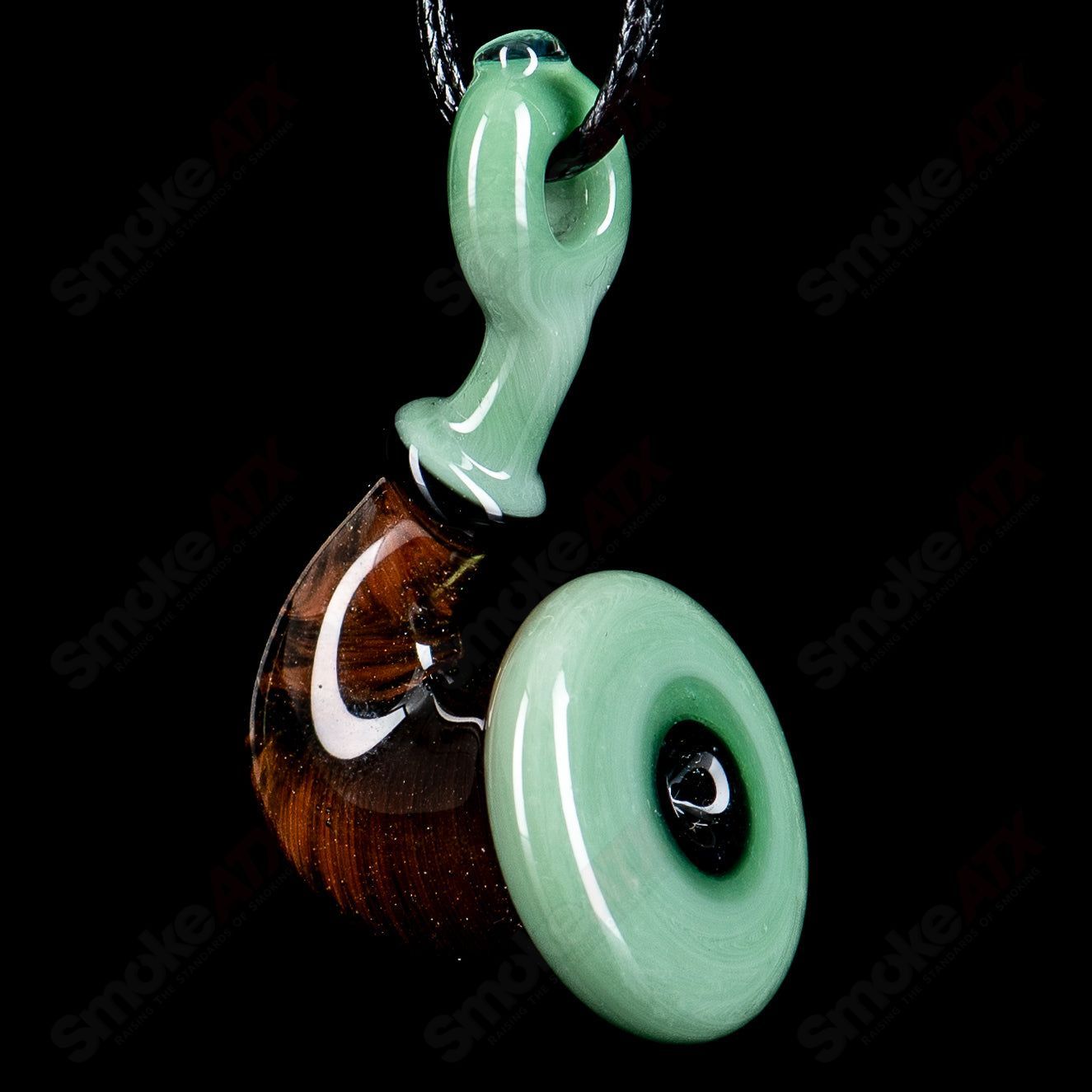 JMass Sherlock Pendant made of heady glass, featuring intricate design and vibrant colors, hanging from a chain.