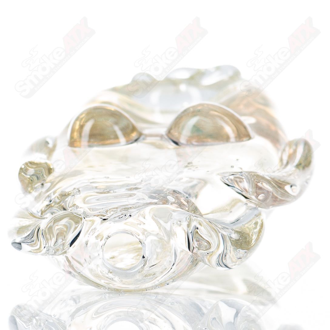 Glass Goddess Pipe by Nobody, clear glass pipe with intricate goddess design, smooth surface, and rounded mouthpiece.