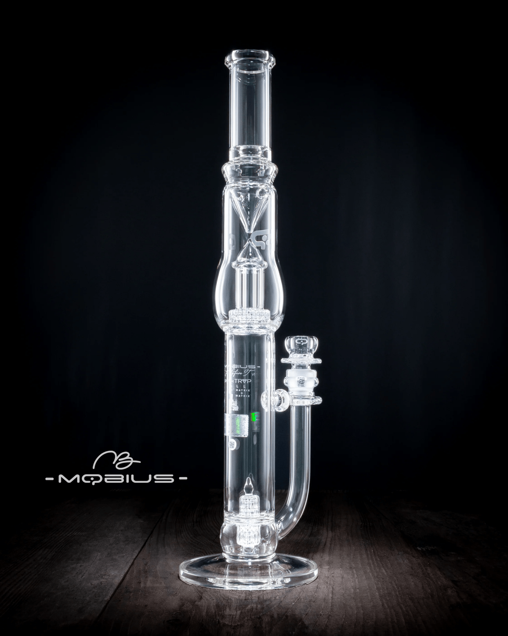 Glass waterpipe with 45T Tall Stereo Matrix and Matrix Splash Trap V1 by Mobius, featuring intricate glass design and clear features.